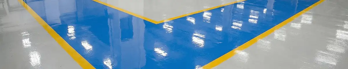 A factory floor professionally covered and marked with epoxy flooring in Fresno, CA