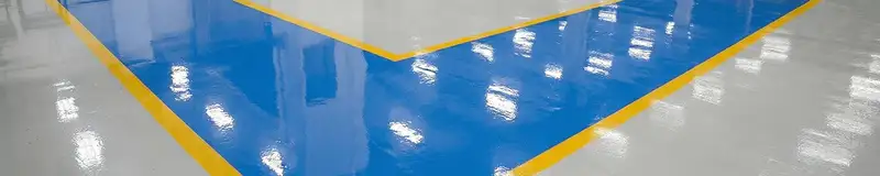 A factory floor professionally covered and marked with epoxy flooring in Fresno, CA