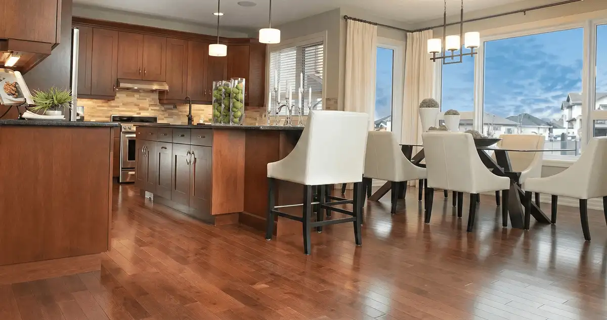 A modern kitchen with professionally installed wood flooring in Fresno, CA