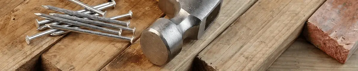 Hammer and nails on hardwood flooring boards in Fresno, CA