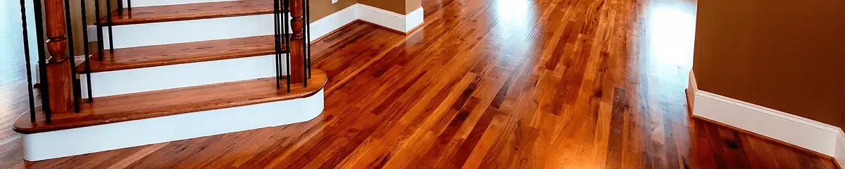 Base floor of a staircase with professionally restored wood flooring in Fresno CA