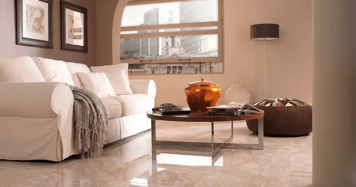 Modern living room with professionally installed marble flooring, a beige sofa, coffee table in Fresno, CA