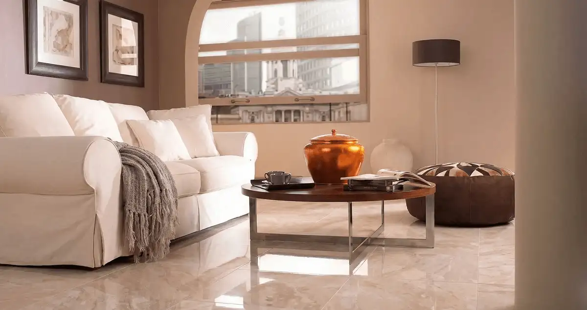 Modern living room with professionally installed marble flooring, a beige sofa, coffee table in Fresno, CA